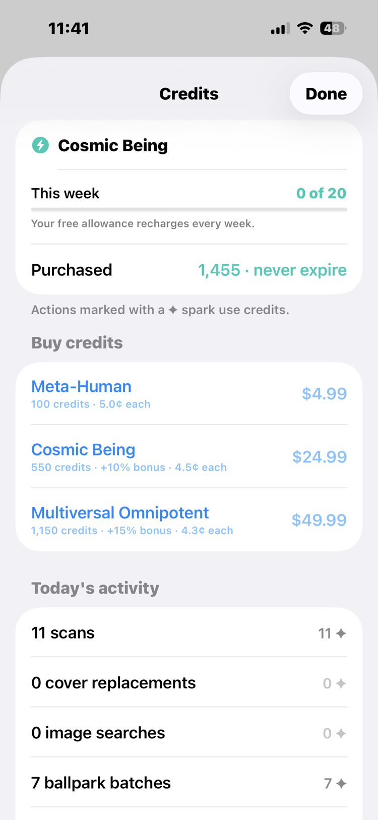 The Credits screen: the Cosmic Being rank, a weekly free allowance shown as 0 of 20 that recharges every week, 1,455 purchased credits that never expire, three credit packs from $4.99 to $49.99 with per-credit prices and bulk bonuses, and today's activity of 11 scans and 7 ballpark batches.