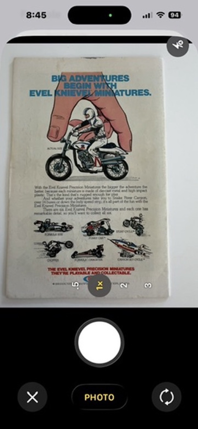 Photographing the back cover, an Evel Knievel Miniatures advertisement.